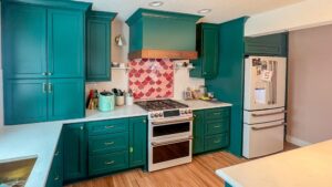 kitchen with green cabinets and drawers after painting